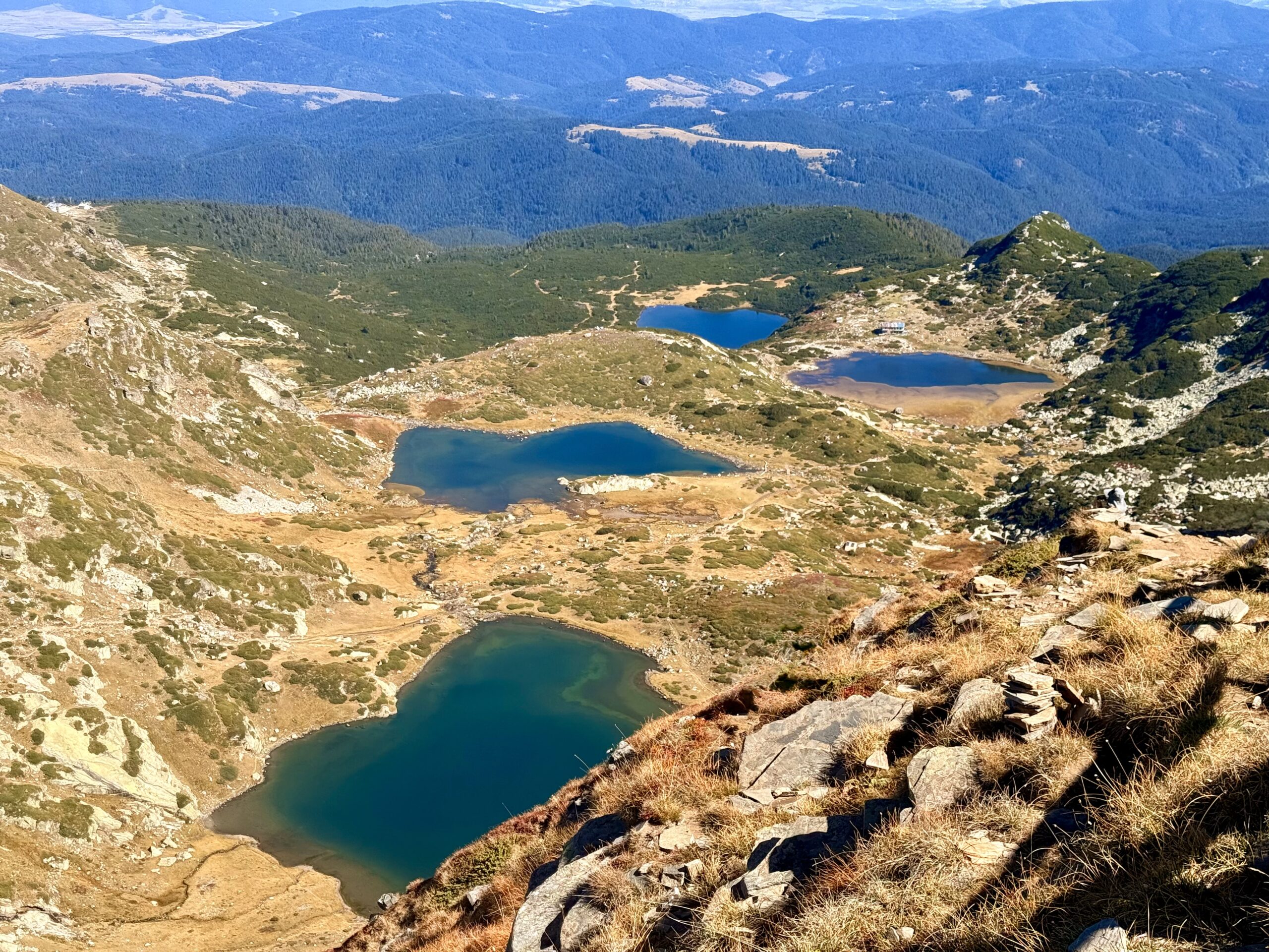 Panoramic view of several Seven Rila Lakes from the mountain trail